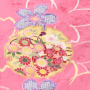 ピンクの振袖ケープスリーブドレスに咲く桜柄